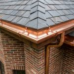 Do you want to learn how to cut half round gutter miters like this close up shot of a perfectly cut 90 degree outside miter on copper half round guttering?